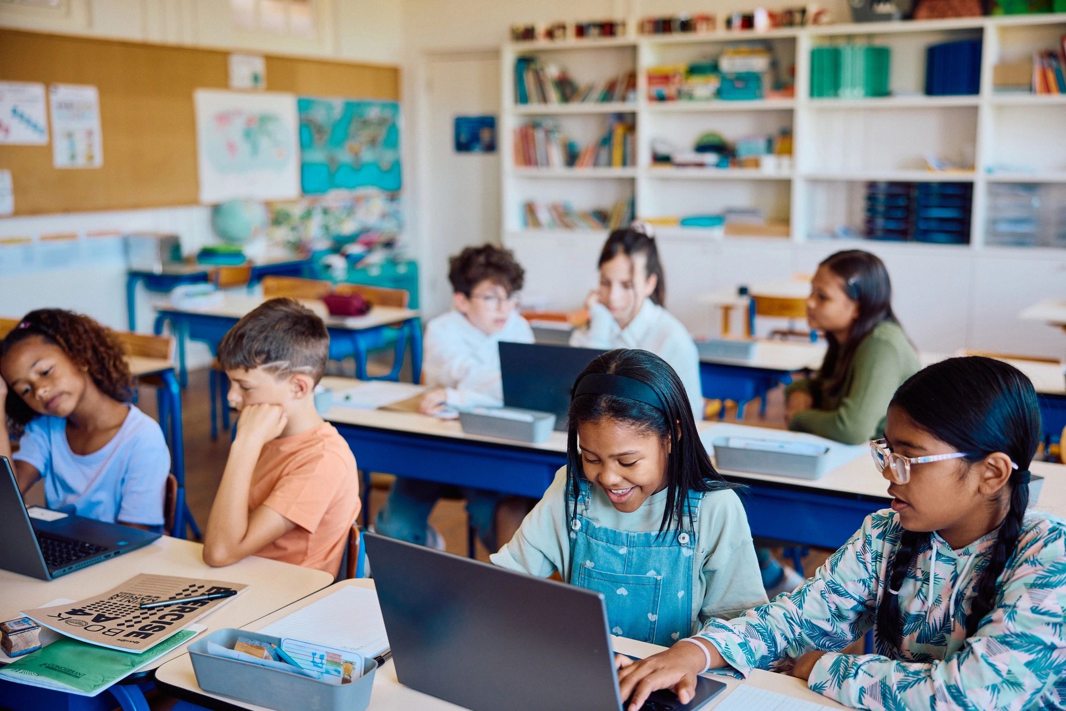 Students learning together in a bright classroom